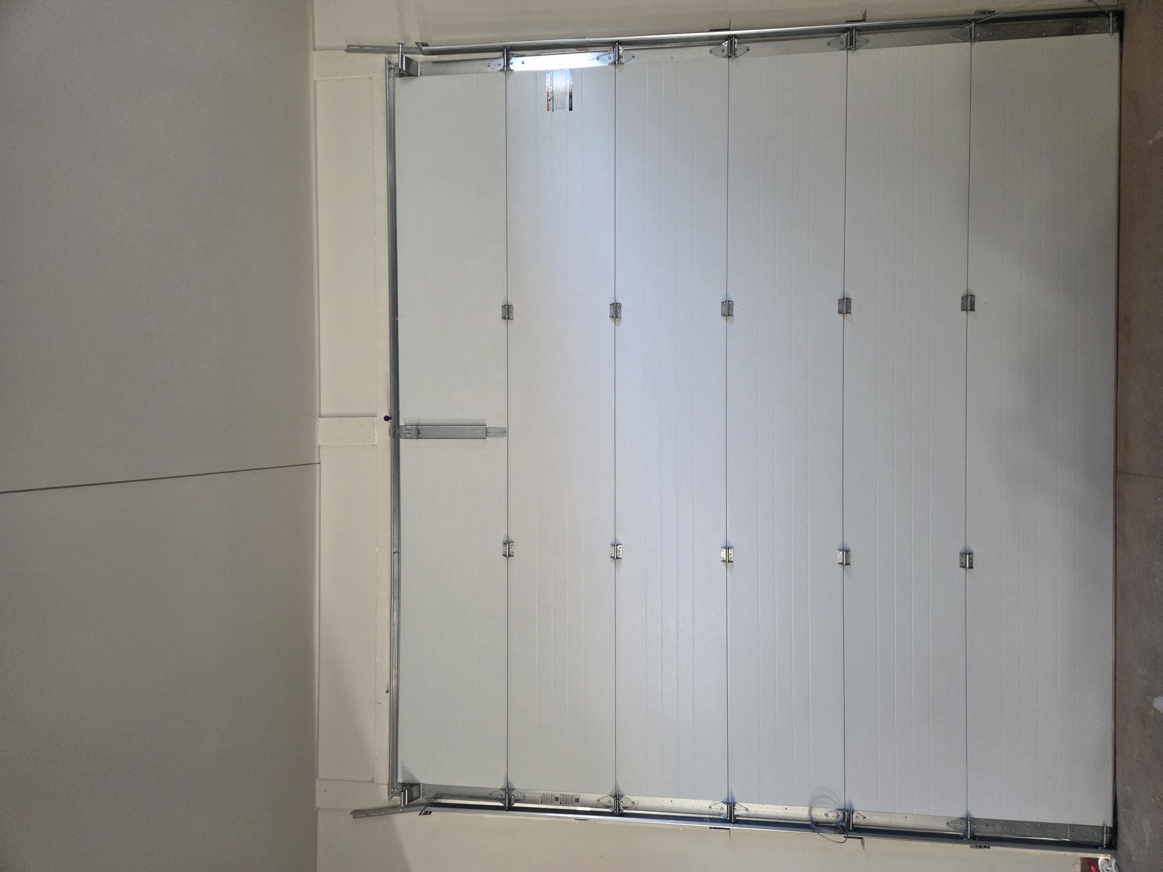 Completed garage door installation viewed from inside the garage
